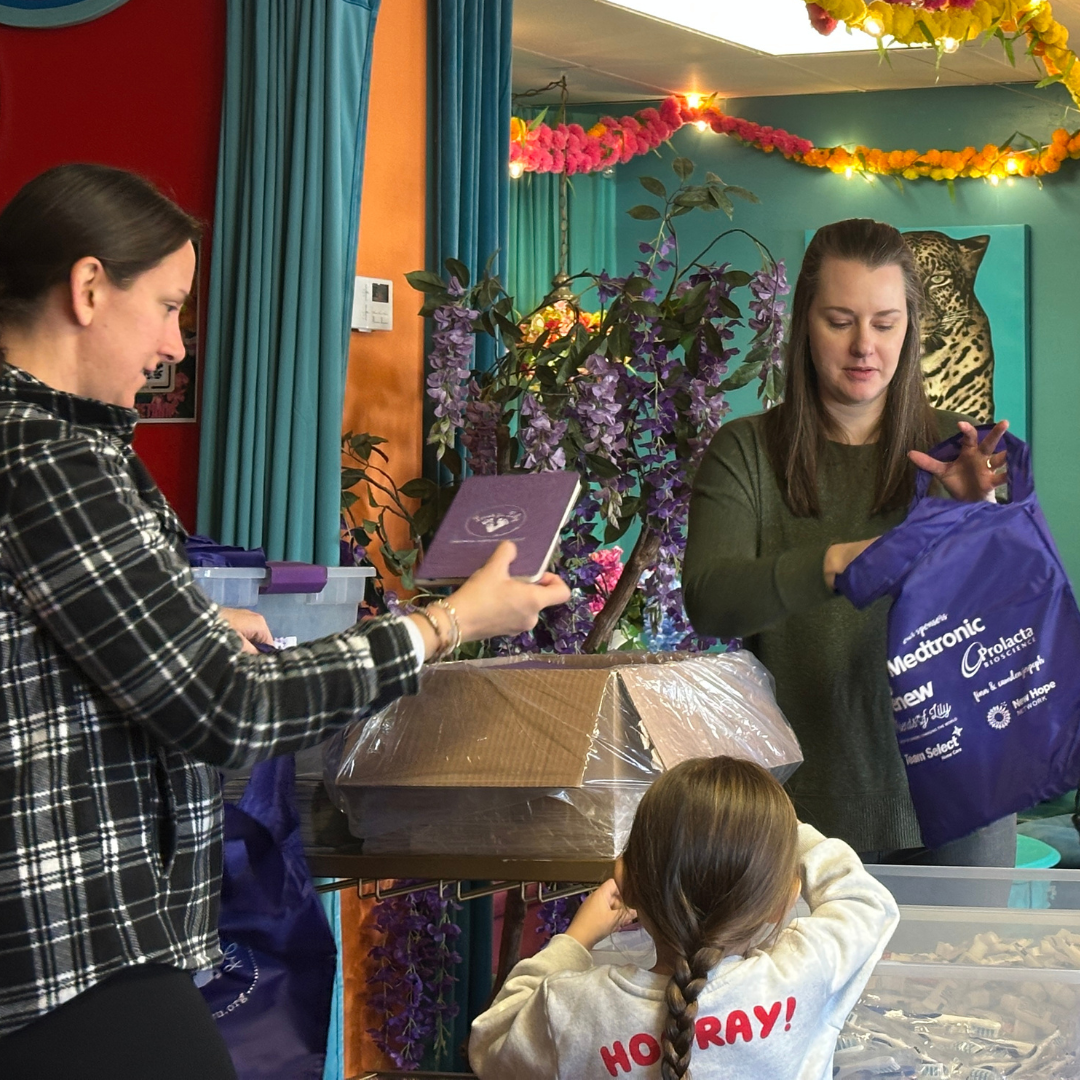 Volunteers packing essentials bags.